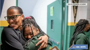 Mashea Ashton hugs a student in a screengrab from NBC4 News.